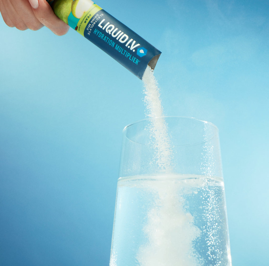 Image of a stick of Liquid I.V.® being poured into a glass. 