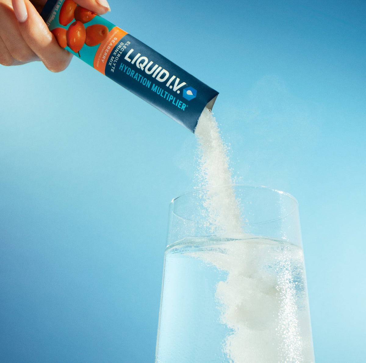 Image of a stick of Liquid I.V.® being poured into a glass. 