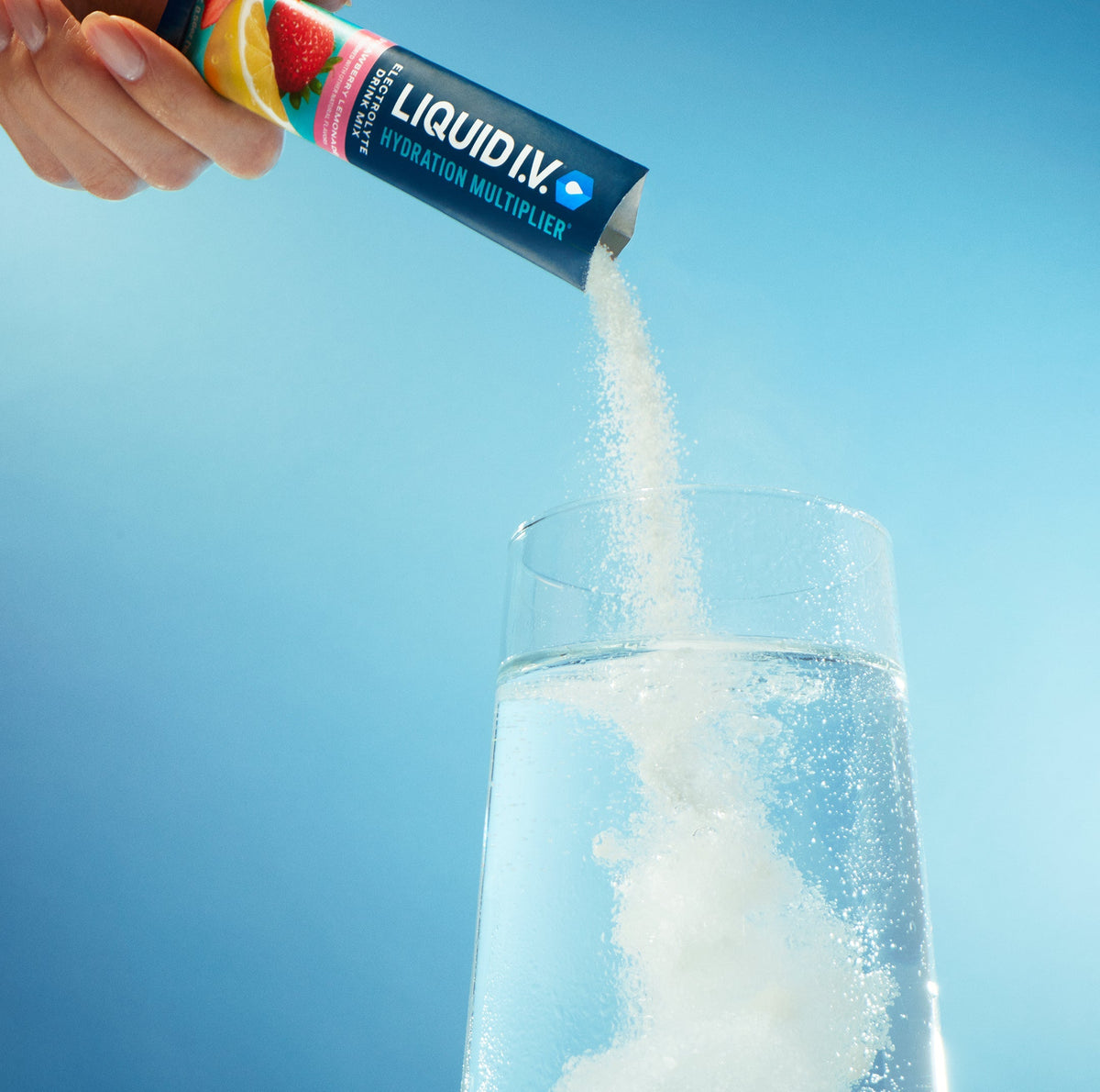 Image of a stick of Liquid I.V.® being poured into a glass. 